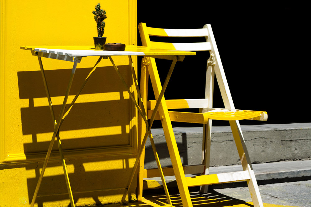 Image of the yellow chair in the sunshine
