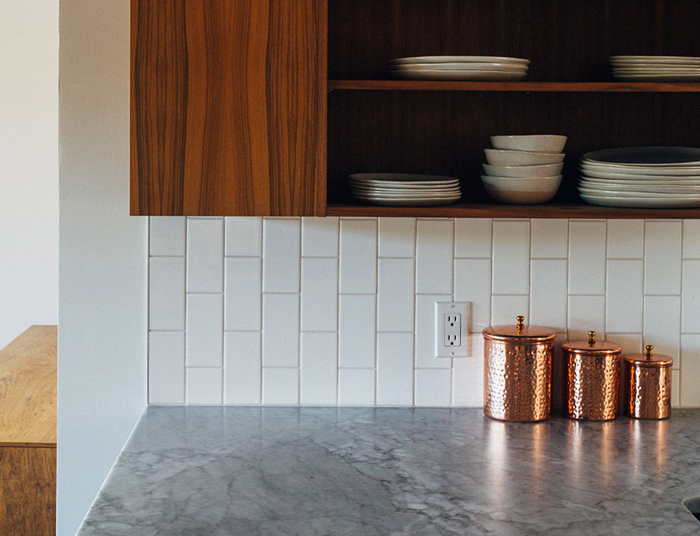 Image of three copper jars on a granite worksurface