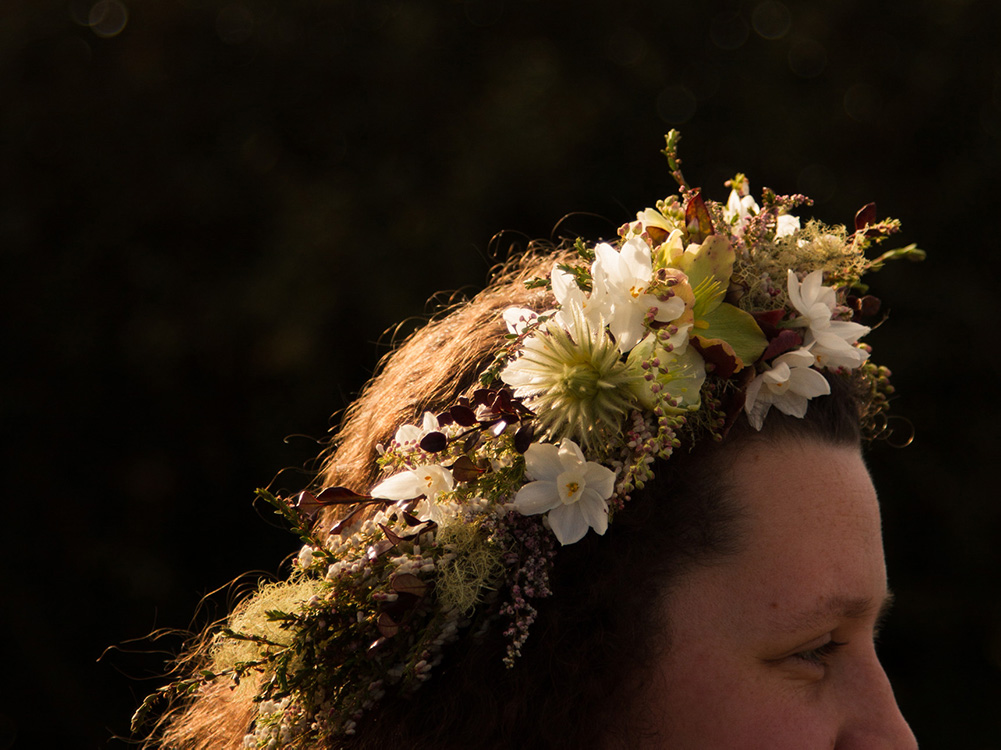 Image of a person wearing a floral crown