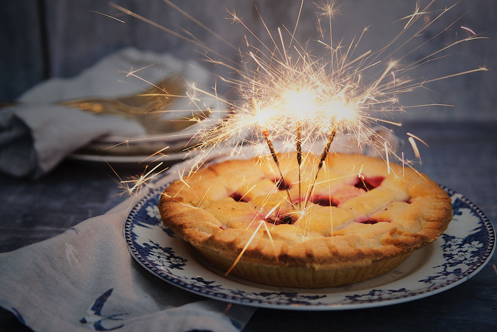 Image of apple pie with sparklers in the top