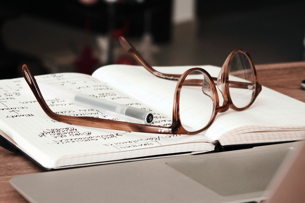 Glasses overturned on a notebook