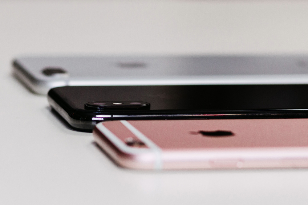 Image of three iPhones laying face down