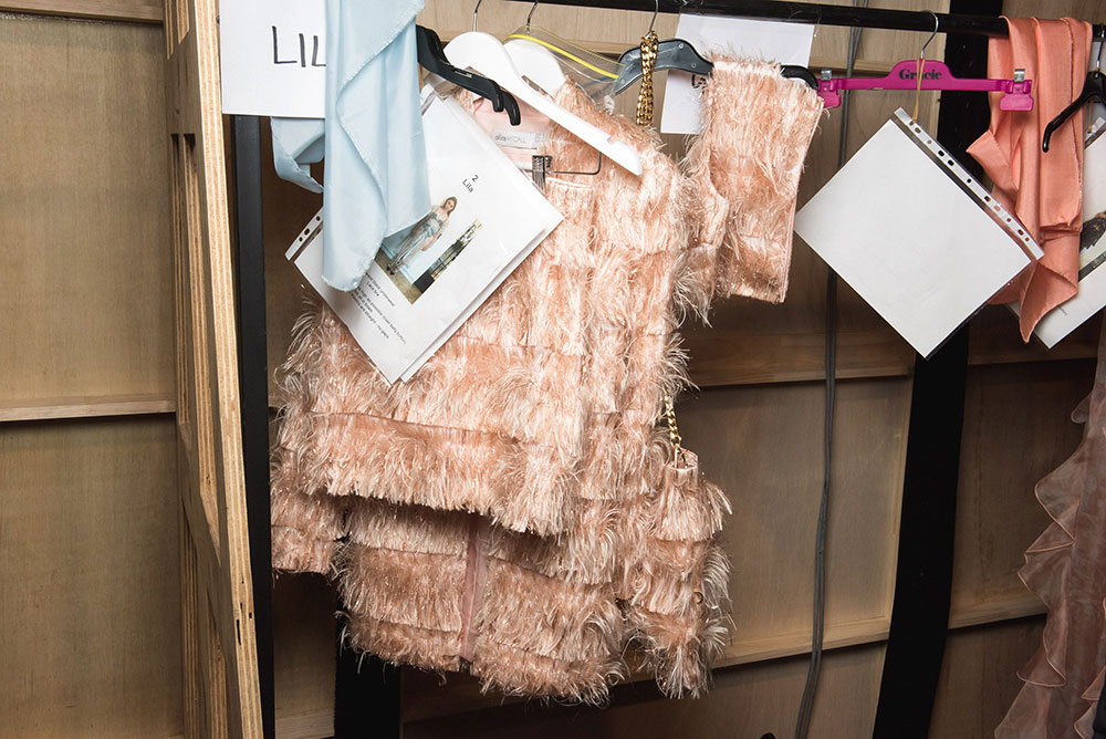 Image of a fringed dress on hanger