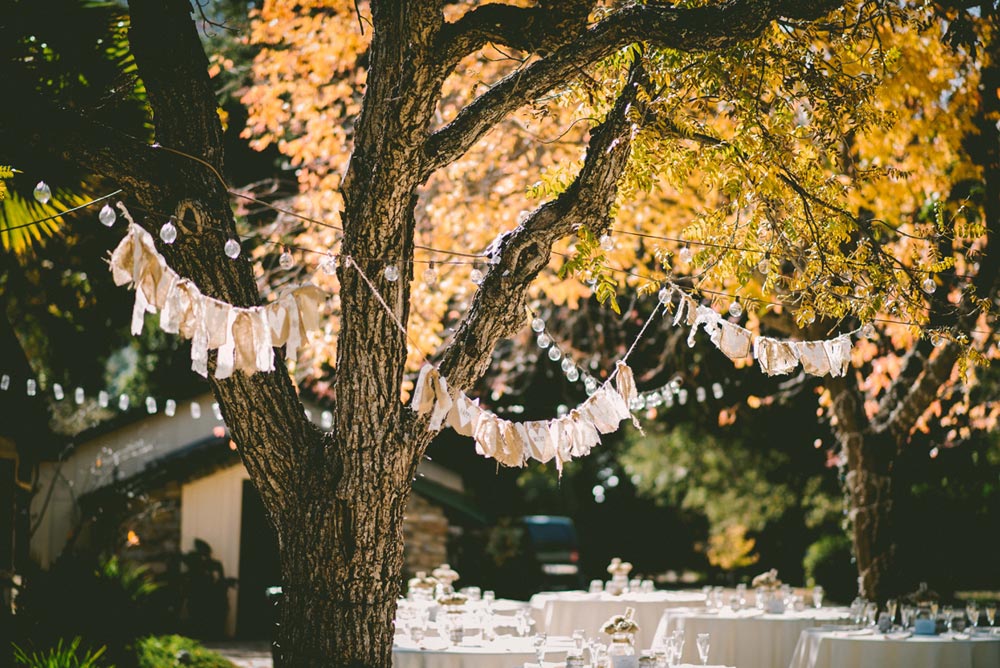 Image of a wedding reception with blush and peach banners