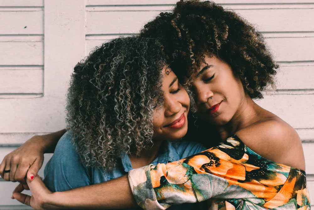 Image of two African American women hugging